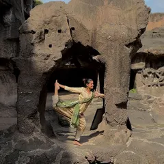 A dance pose inside the ancient Ellora Caves. Wherever I go, I feel the urge to dance, especially in places with such powerful spiritual energy.