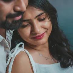 A serene and intimate close-up, where the couple finds a quiet moment together. The soft lighting enhances the gentle mood.