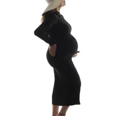 A striking silhouette of a mom-to-be against a white background. This high-key lighting technique creates a bold and modern portrait that is both artistic and timeless.