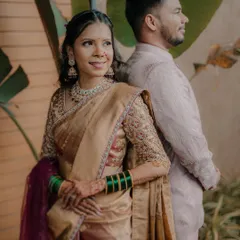 A modern pose with a traditional heart. This portrait captures the couple back-to-back, highlighting the bride's confident smile and classic attire.