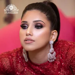 This is for the client who loves a bold statement. I created a dramatic smokey eye with a touch of glitter, paired with a matte nude lip to balance the look. It’s the perfect high-impact party makeup for a cocktail night or reception.