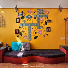 Another view of the Scrabble wall art, showing how it serves as a stunning backdrop for the seating area.