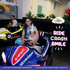 Ride, crash, and smile! This photo perfectly captures the simple joy of our bumper cars. It's one of the most loved attractions at House of Giggles, guaranteed to bring a smile to your child's face.
