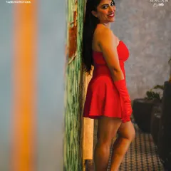 A dynamic pose from a professional shoot, showing a vibrant and energetic side. This look is ideal for lively parties and product launches.