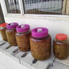 My pickles are cooked the traditional way, under the sun. These large jars of Aam ka Achaar will sit outside for months to cure naturally. This slow process develops a deep, complex flavour that you can't get any other way.
