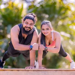 A celebratory fist bump after a set of push-ups. I love capturing these moments of shared accomplishment and fun during a themed pre-wedding shoot.
