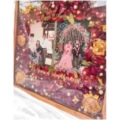 A 25th anniversary is a milestone of love worth celebrating and preserving. For this special gift, I used the couple's original wedding flowers, photos, and names in a beautiful teakwood resin frame to honor their incredible journey together.