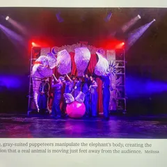 A stage photo showing the incredible puppetry that brings the elephant to life. The music had to match this visual magic, creating a sense of awe and emotion for the audience.
