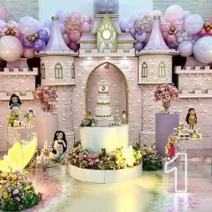 A full view of our magnificent princess castle, featuring a multi-tiered cake, character figurines, and a stunning floral base. This is one of our most detailed and immersive setups.