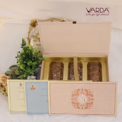 This sophisticated pastel pink box contains three jars of gourmet mixed nuts and is paired with a suite of matching wedding cards. The design is clean and modern, with a touch of traditional elegance in the monogram.