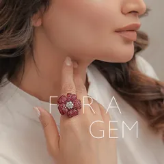 A floral gem that wraps your finger in the splendor of rare gems. This large flower ring is meticulously crafted with invisible-set rubies and a central diamond cluster, creating a seamless surface of colour and sparkle.