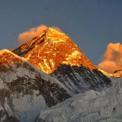 The golden hour light hitting the peak of Mount Everest. This is a sight that makes the challenging trek completely worth it.