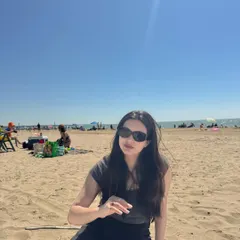 A candid selfie from a sunny beach day. This type of content feels personal and authentic, as if taken straight from a friend's camera roll.