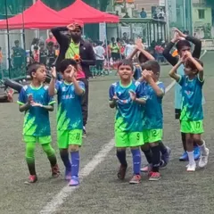 The pre-game hype! Our U9 football team gets energized and ready to take the field for their KSFA youth league game.