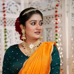 A three-quarter profile showcasing the clean lines of the makeup and the elegant hairstyle. This look is perfect for a bride who wants a unique and memorable style.