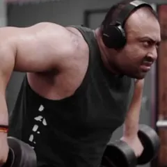 Training back with heavy dumbbell rows. A strong back is the foundation of a big deadlift.