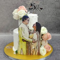 Another example of our edible portrait wedding cakes. This two-tiered cake features a lovely illustration of the couple, surrounded by fresh flowers.