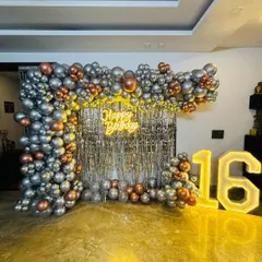 A full view of our shimmer wall and balloon decoration, a popular choice for milestone birthdays and bachelorette parties. The combination of reflective sequins, metallic balloons, and bright lights creates a high-energy, celebratory focal point.