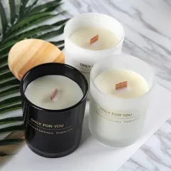 For a sleek, modern look, I offer these black and frosted white glass jar candles with wooden wicks. These are available for bulk orders with custom branding.