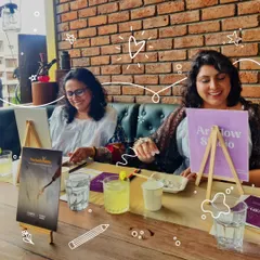 Two friends share a smile as they work on their canvases in our textured art experience. It's a perfect weekend activity to unwind, socialize, and explore a new form of creative expression.