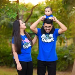 This photo shows how a simple theme, like matching "Shark" family t-shirts, can add so much personality to a shoot. The joy on their faces is completely genuine.