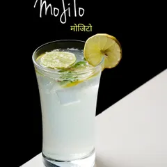 A classic Virgin Mojito, shot with a dramatic black and white background. This technique makes the drink stand out and gives it a sophisticated, high-end look suitable for a cocktail menu.