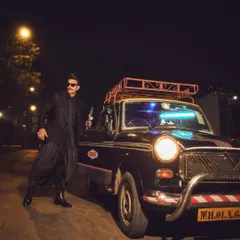 The full look of Ranveer Singh's 'Desi Kalakar' outfit. The combination of a structured blazer with flowing, draped pants creates a unique and modern silhouette for men's formal wear.