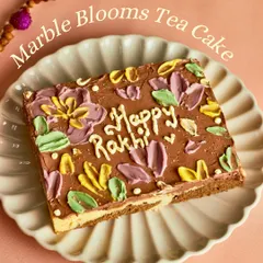 Our Marble Blooms Tea Cake, specially decorated for Rakhi. This beautiful and delicious cake is perfect for celebrating with your siblings.