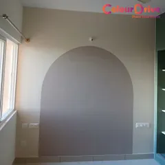 We created a modern arched pattern on this wall using a two-tone paint effect. This is an affordable way to add a custom design element to a room, serving as a focal point behind a bed or sofa.