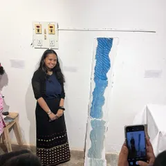 A proud participant poses with her unique, sculptural cyanotype creation at the end of a workshop. It's always rewarding to see the incredible art that comes out of these sessions.