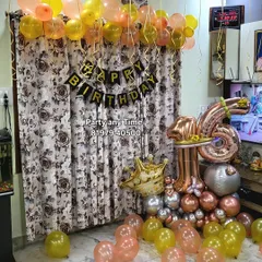 A 16th birthday home decoration showing a number bouquet and helium balloons. All items are available to buy or rent.