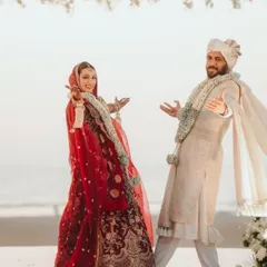 The happy couple striking a pose after their wedding. Their joy and energy are infectious. So much love for them.