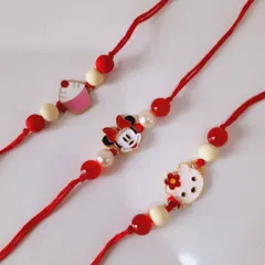 So much cuteness in one picture. These handmade Rakhis feature Hello Kitty and Minnie Mouse charms on a simple red and white beaded thread, perfect for your little sister or brother.