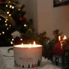 Saying bye to the most wonderful time of the year. This 'Winter Wonderland' candle, with its three wicks, cast a beautiful glow on the last of the Christmas decorations, filling the room with a festive scent.