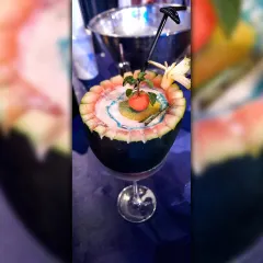 A truly unique creation served inside a hollowed-out watermelon. This cocktail is not just a drink but a conversation starter, perfect for tropical-themed or summer parties.
