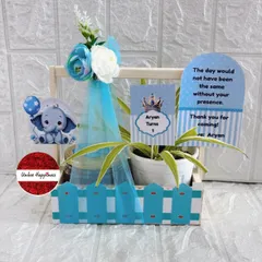 Announce your baby boy with this adorable blue-themed favor. It includes a plant, treats, and a personalized card featuring a cute elephant and a thank you message from baby Aryan.