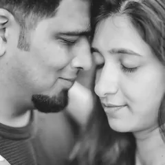 An intimate close-up of Anjali and Platini. Removing color allows the viewer to focus on their expressions and the quiet connection in this moment.