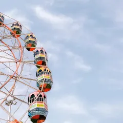 A colorful Ferris wheel is framed against a bright blue sky at a local mela. I love finding these simple, graphic compositions that evoke a sense of fun and nostalgia.
