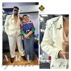A closer look at the hand-painted white suit. The red roses symbolize love and romance, and we even added a small butterfly detail on the shoulder for an extra touch of artistry.
