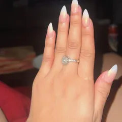 The perfect engagement photo nails. This set features a soft, milky ombré on long, elegant stiletto-shaped extensions, finished with a subtle chrome glaze.