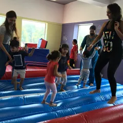 Bouncing with friends and parents on the giant Air Track. It's big enough for everyone to join in the fun, making it a highlight of any party.