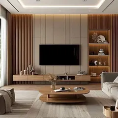 A wide view of a living room with a full-wall TV unit made of wood and fluted panels. The design incorporates both open and closed storage, with warm backlighting to highlight the decorative shelving.