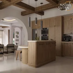 This angle shows the kitchen's connection to the adjoining living space through a wide archway. The design maintains a cohesive flow with consistent wood tones and exposed ceiling beams.