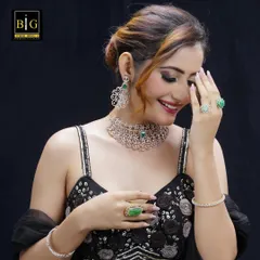 This is another look from the same jewelry campaign. The elegant updo is styled to showcase the model's profile, ensuring the intricate earrings and necklace are perfectly visible.