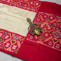 A beautiful single Ikkat silk saree in cream and red. The heart motifs woven into the border add a charming and unique touch to this traditional piece.