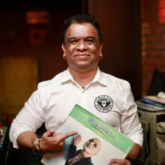 Holding up a classic record during my vinyl set. Each record has a story, and I love sharing them with the crowd.