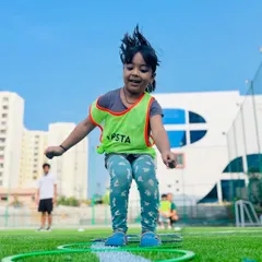 Pure joy in motion. A young player jumps through agility rings, building coordination and having a blast. Our training for the 3-5 age group is packed with fun activities that improve fitness without feeling like a workout.