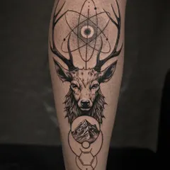 A fusion of the natural and the geometric. This tattoo places a realistic deer portrait within a framework of sacred geometry, including an atom symbol and other abstract shapes, creating a unique and thought-provoking piece.
