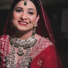 The happy glow of a bride on her wedding day. This candid shot from a destination wedding in Igatpuri showcases the flawless, long-lasting makeup that shines through her smile.
