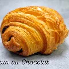 The classic Pain au Chocolat. This timeless French pastry features our signature flaky croissant dough wrapped around sticks of rich dark chocolate.